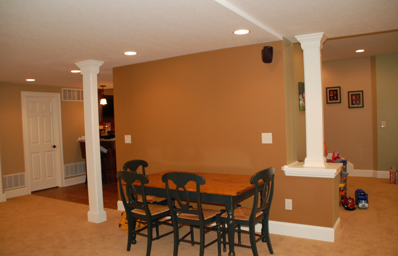 Accent columns to hide poles in basement