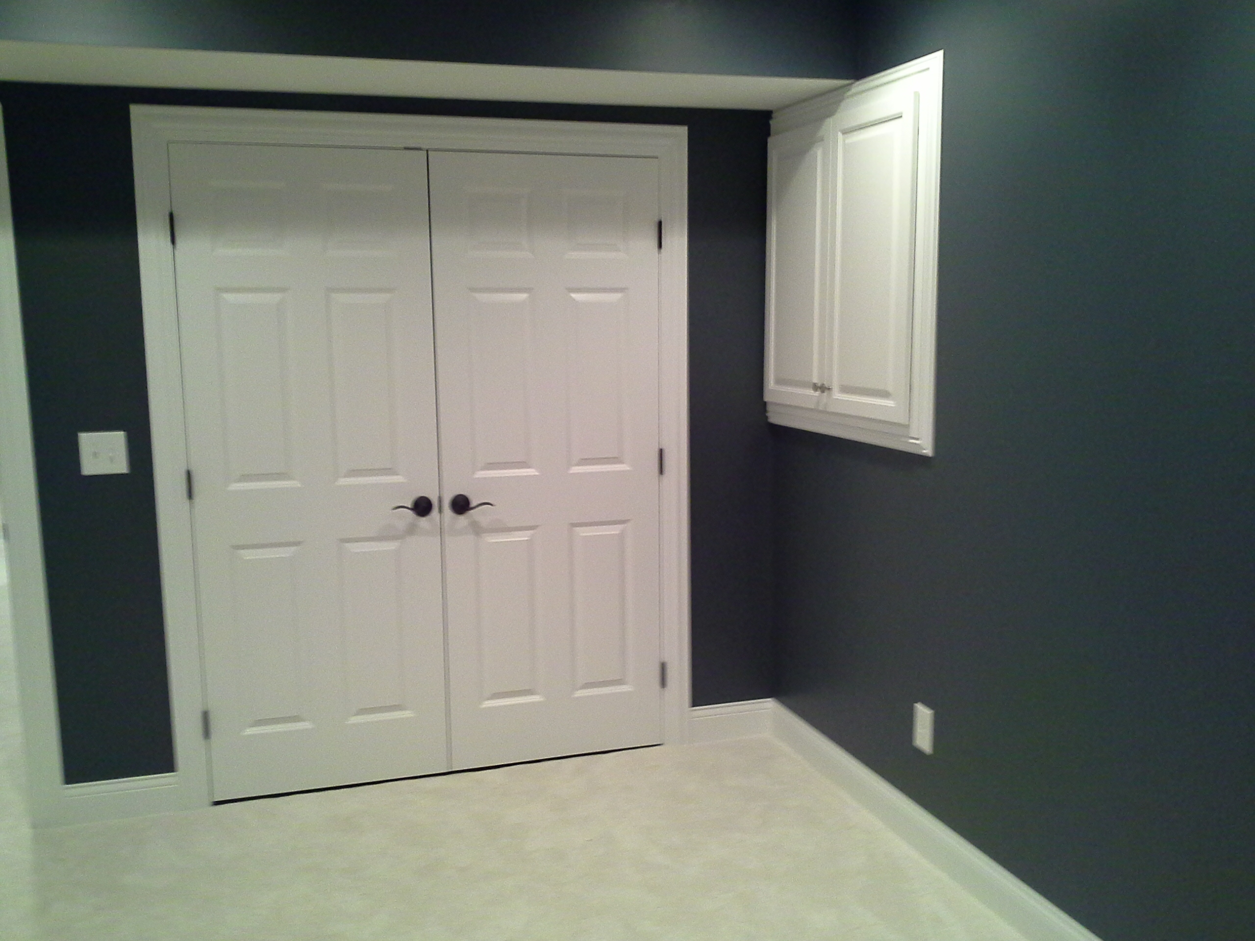 Hiding electric in basement behind doors