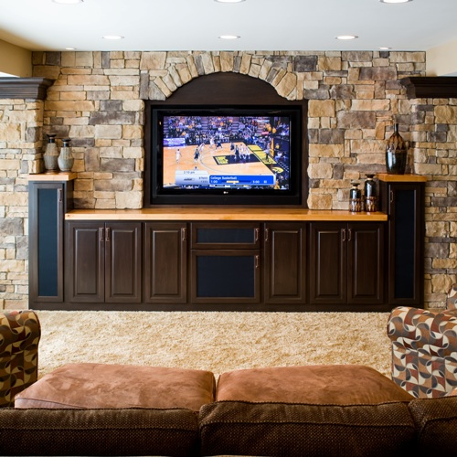 Luxury Basement Remodeling Built in TV with custom stone Dublin Luxury Basement Remodeling Dublin Tartan Fields www.basementsunlimited.net