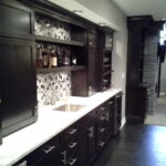 Modern Finished Basement Wet bar with white marble counter and glass tile Modern Finished Basement Wet bar with white marble counter and glass tile