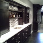 Modern Finished Basement Wet bar with white marble counter and glass tile Modern Finished Basement Wet bar with white marble counter and glass tile