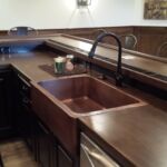 Custom Basement Renovation Copper farm sink with drink ledge and custom wood bar top in Dublin basement Custom Basement Renovation Copper farm sink with drink ledge and custom wood bar top in Dublin basement