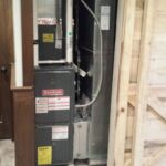 Hide utilities inside barn door in basement renovation Hide utilities inside barn door in basement renovation