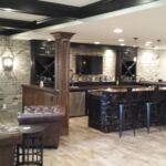 Main TV and custom wet bar area in finished basement Main TV and custom wet bar area in finished basement